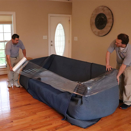 Couch safety wrapping before move.